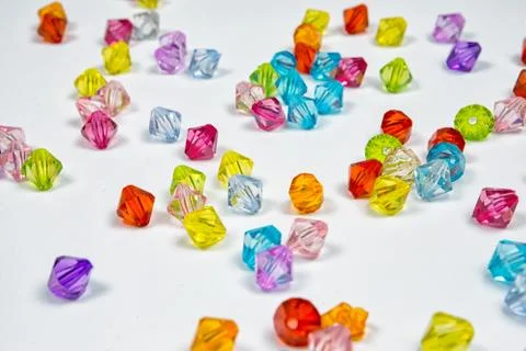 Colored beads for design on a white background Stock Photos