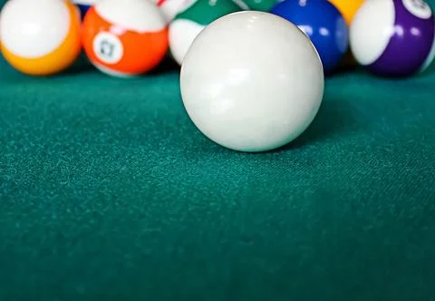 Colored Billiard Balls on green table concept with empty place, close up Stock Photos