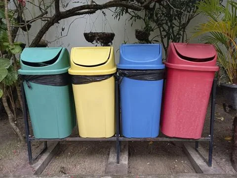 Colored bins for selective garbage collection Stock Photos