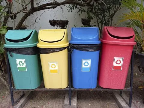 Colored bins for selective garbage collection Stock Photos