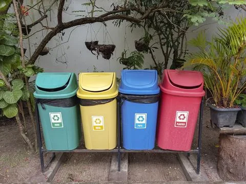 Colored bins for selective garbage collection Stock Photos