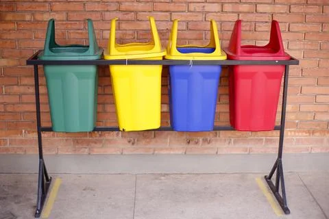 Colored bins for selective garbage collection Stock Photos