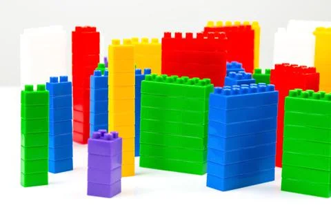 Colored blocks of a plastic constructor on a white background in the form of  Stock Photos