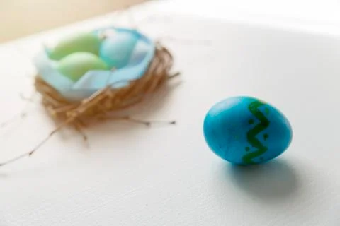 Colored blue easter eggs in twig nest. Happy easter concept. Greeting card Stock Photos
