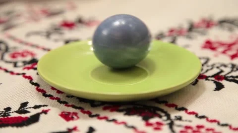 Colored blue egg for Easter is spinning Stock Footage 131147176