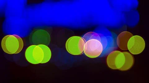 Colored blurred bokeh. abstract background of included festive garlands. colo Stock Photos