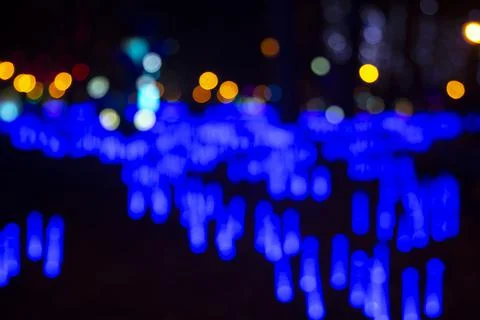 Colored blurred bokeh. abstract background of included festive garlands. colo Stock Photos