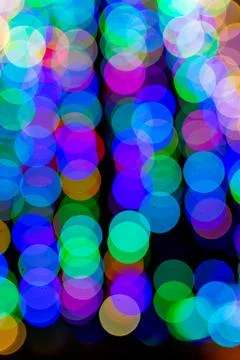 Colored blurred lights, defocused background. New Year Christmas background with Stock Photos