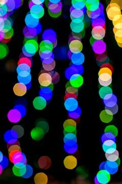 Colored blurred lights, defocused background. New Year Christmas background with Stock Photos
