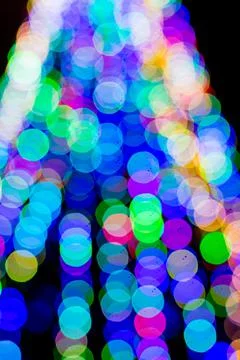 Colored blurred lights, defocused background. New Year Christmas background with Stock Photos