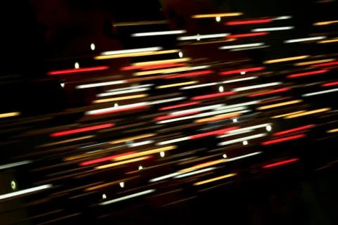 Colored blurred lines of light on dark Stock Photos