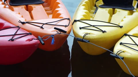 Colored boats connected to each other near from the shore. Stock Footage 138829301