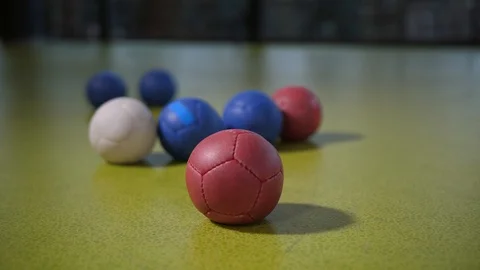 Colored boccia balls on floor surface during game Stock Footage 125783861