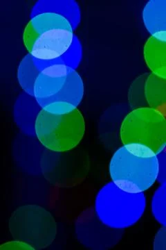 Colored bokeh on a dark background Stock Photos