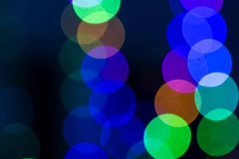 Colored bokeh on a dark background Stock Photos