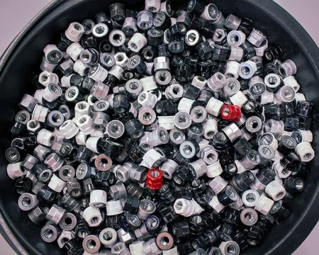 Colored bolt nuts for mounting wheels on the car, top view Stock Photos