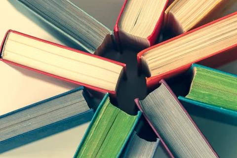 Colored book covers, top view. Education background. Stock Photos