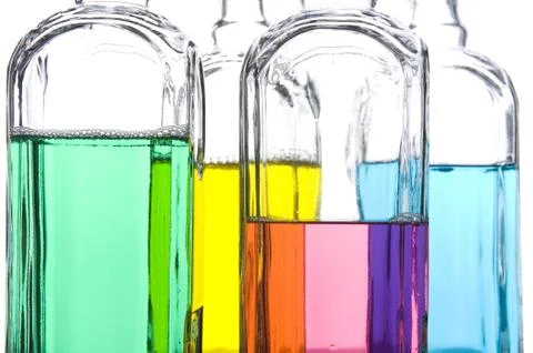Colored Bottle with liquid closeup Stock Photos