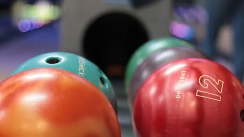 Colored bowling balls in the club Stock Footage 106295482