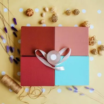 Colored boxes in festive decor. A place for a logo. Flat ley. Top view. The Stock Photos