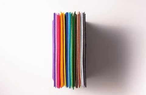 Colored bright felt sheets with stripes on a white background with shadow Stock Photos