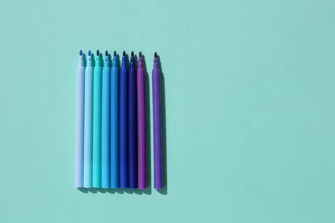 Colored, bright, stylish felt-tip pens on a bright, colored background. Stock-Fotos