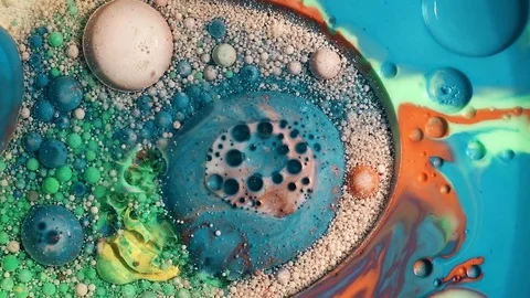 Colored bubbles of paint on the oil surface Stock Footage 80855967