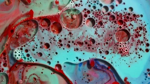 Colored bubbles of paint on the oil surface Stock Footage 80855990