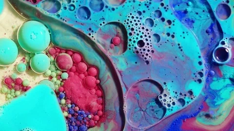 Colored bubbles of paint on the oil surface Stock Footage 80895773