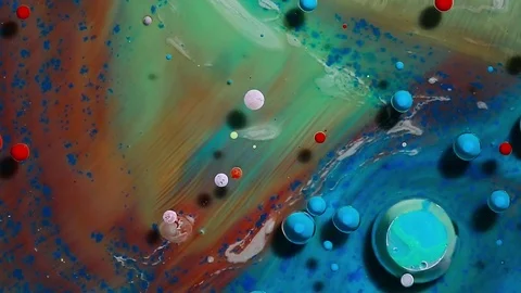 Colored bubbles of paint on the oil surface Stock Footage 81071536