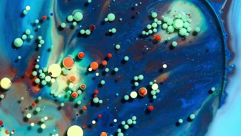 Colored bubbles of paint on the oil surface Stock Footage 81072326