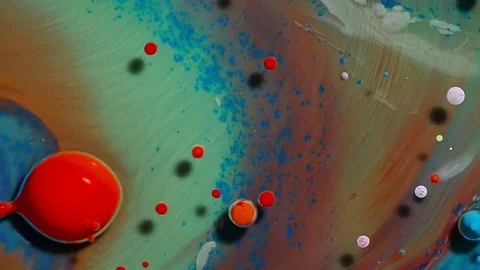 Colored bubbles of paint on the oil surface Stock Footage 81246907