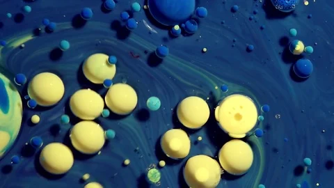 Colored bubbles of paint on the oil surface Stock Footage 81247638