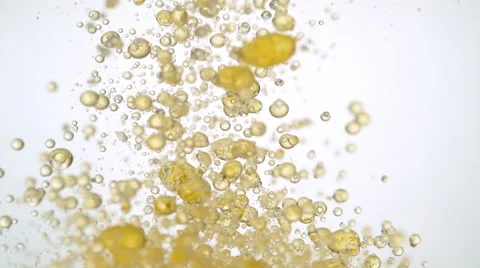 Colored bubbles rising in water. Slow Motion. Stock Footage 65372427