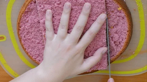 Colored cake sponge cake in the form of a house Smear with cream Stock-Footage 123576764