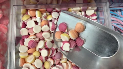 Colored candies, mix of sweets and lollipops rotating. Sweet sugar dessert Stock Footage 314097722