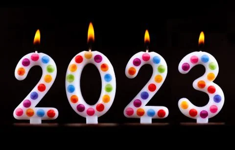 Colored candles write numbers flame Happy new year 2023 Stock Photos