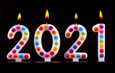 Colored candles write numbers flame Happy new year 2021 Stock Photos