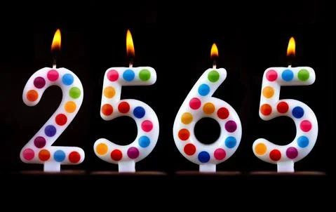 Colored candles write numbers flame Thailand new year 2565 Stock Photos