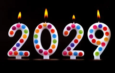 Colored candles write numbers flame Happy new year 2029 Stock Photos