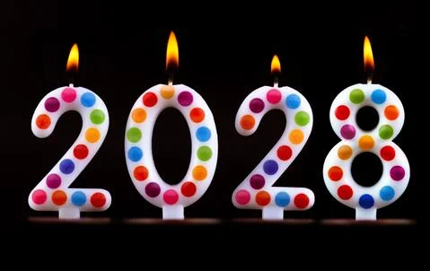 Colored candles write numbers flame Happy new year 2028 Stock Photos