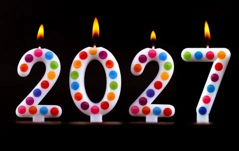 Colored candles write numbers flame Happy new year 2027 Stock Photos