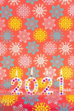 Colored candles write numbers new year 2021 red background Stock Photos