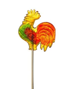 Colored candy on a stick in the form of a cockerel heart and flowers Stock Photos