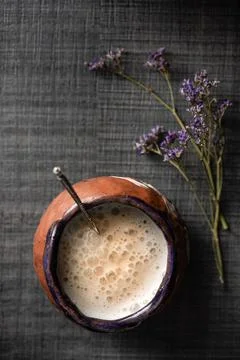 Colored cappuccino mug on a dark background Stock Photos