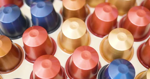 Colored capsules for coffee machine filmed in side dolly motion Vídeo Stock 136112326