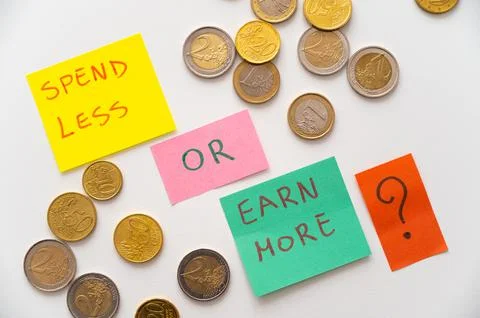 Colored cards with text "spend less or earn more". Stock Photos
