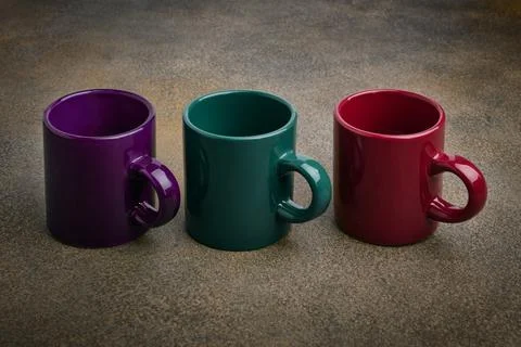 Colored ceramic mugs close up Stock Photos