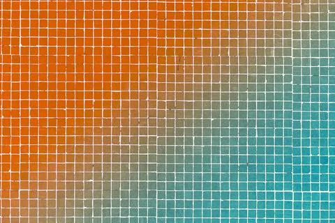 Colored ceramic tile background. Old vintage ceramic tiles in red green gradient 库存照片