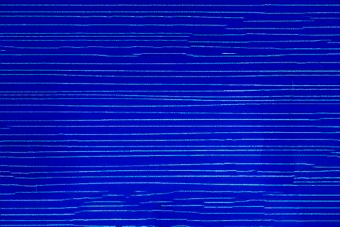 Colored ceramic tiles. Striped blue plastic background. Stock Photos